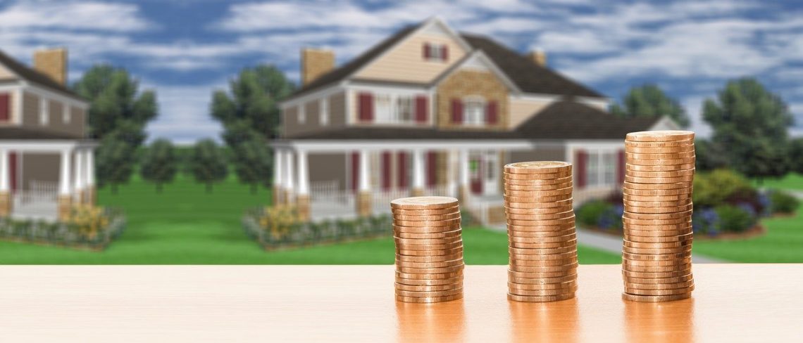 house picture behind picture of coins