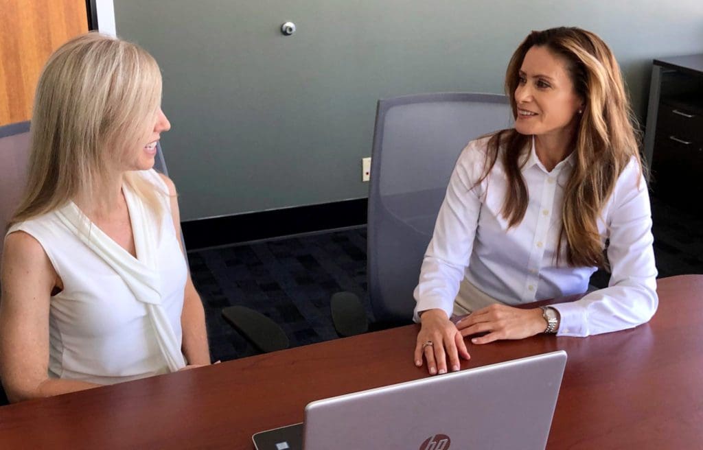 Dawn Delia Speaking to a Client